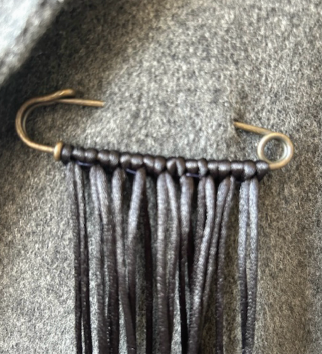 Black ribbon brooch