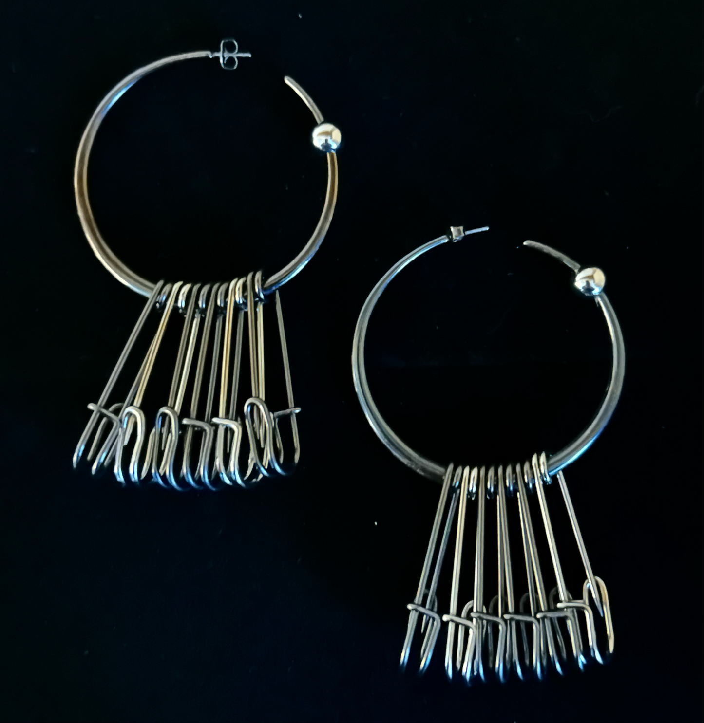 Hoops with safety pin pendants